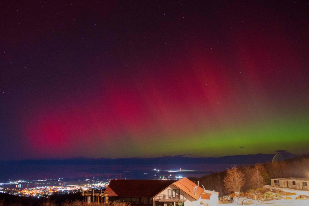 (Files) The Aurora Australis, also known as the Southern Lights, glow on the horizon as seen from Ushuaia, Tierra del Fuego, Argentina on May 10, 2024. (Photo by Alexis Delelisi / AFP)