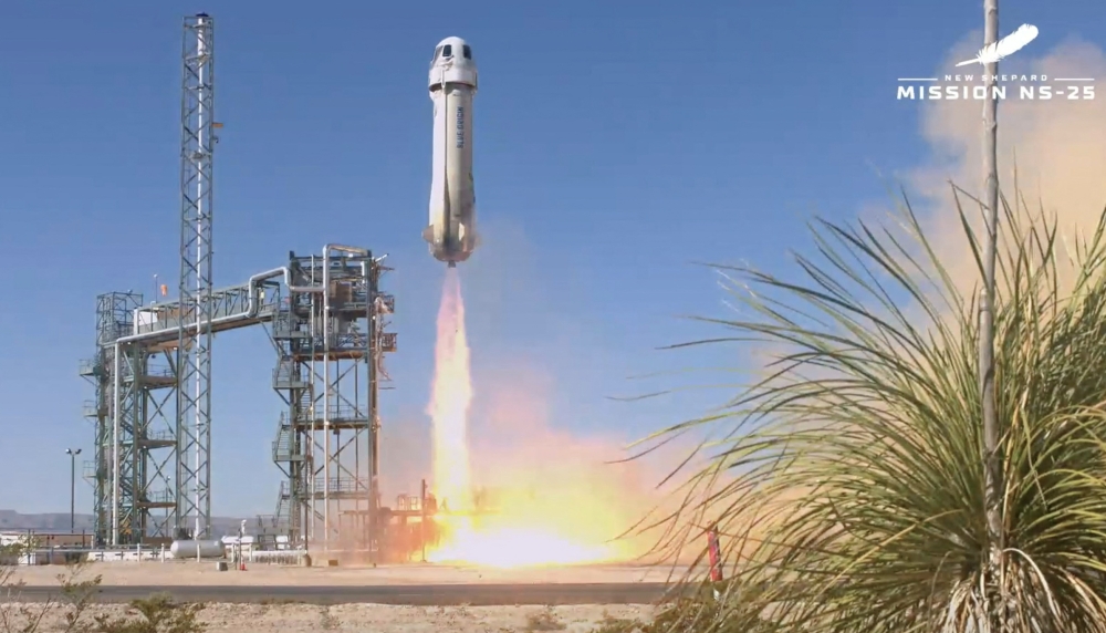 This screen grab taken from a Blue Origin broadcast shows the Mission NS-25, with the New Shepard 4 rocket and crew capsule, taking off from the Blue Origin base near Van Horn, Texas, on May 19, 2024. Photo by HANDOUT / BLUE ORIGIN / AFP