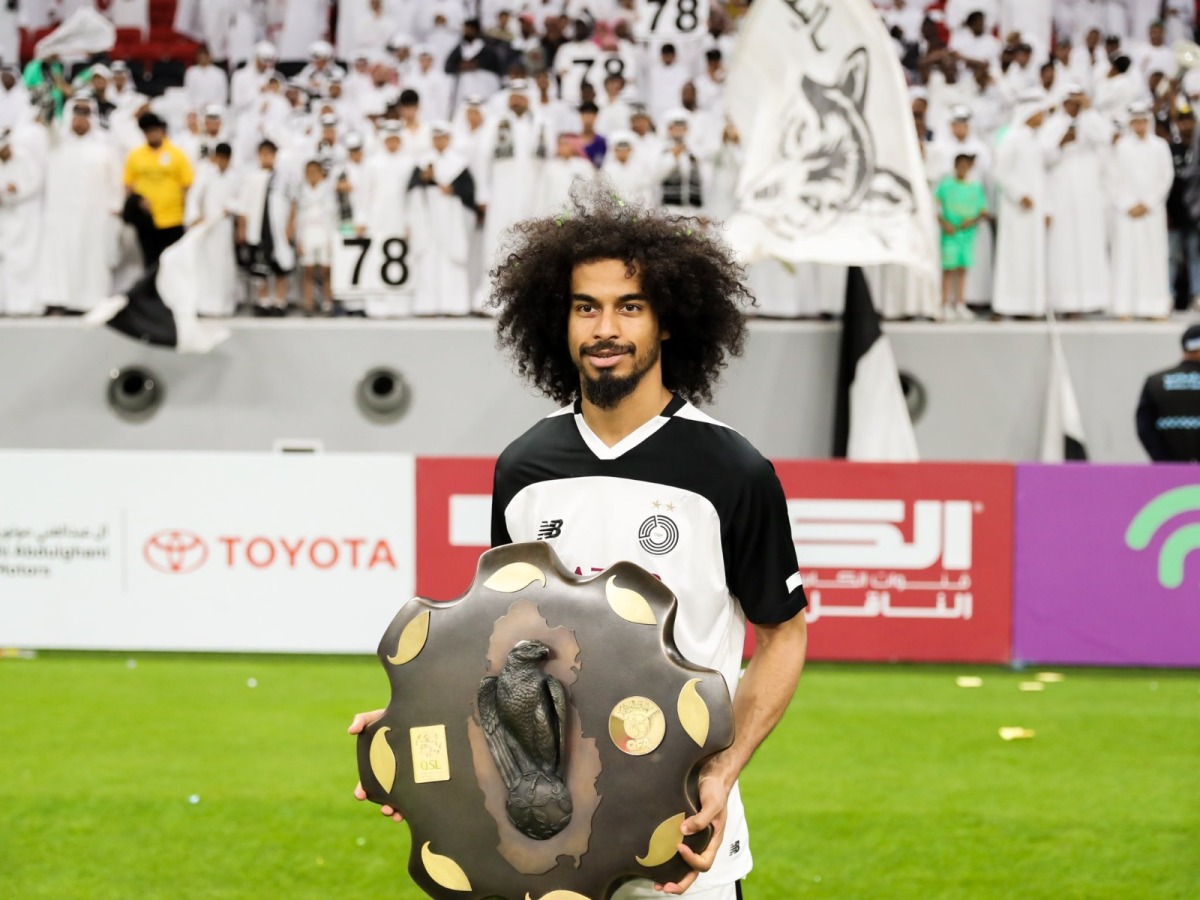 Akram Afif poses with the Falcon Shield after Al Sadd were crowned the Expo Stars League champions last month.