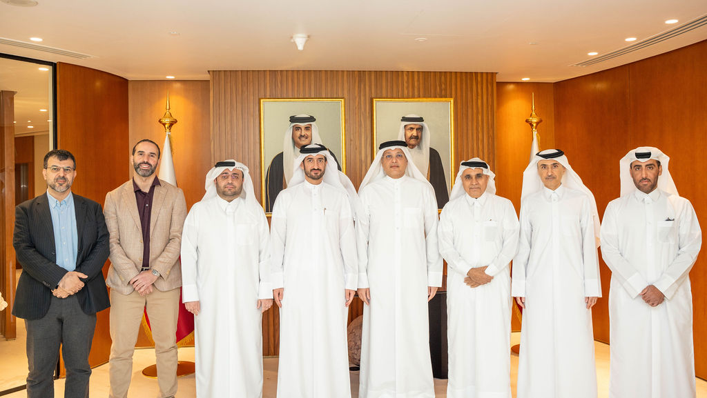 Minister of Communications and Information Technology H E Mohammed bin Ali Al Mannai pose for a group photo with other officials.