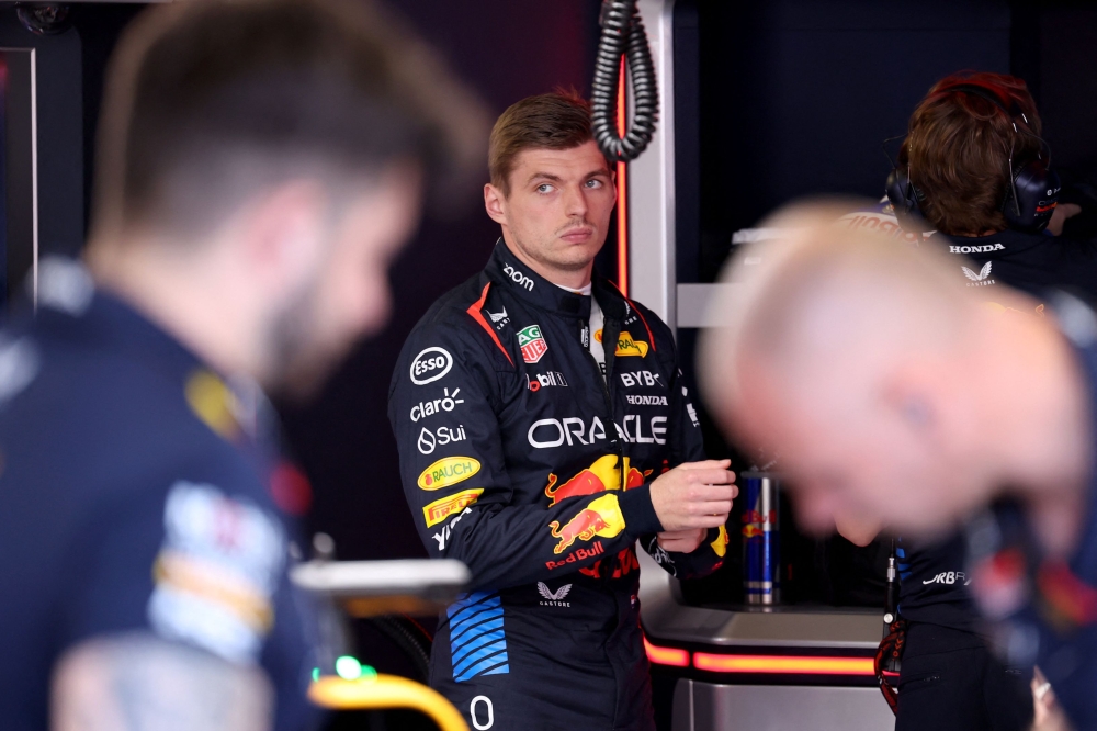 Red Bull Racing's Dutch driver Max Verstappen looks on from the pits during the qualifying session of the Formula One Monaco Grand Prix on May 25, 2024 at the Circuit de Monaco, on the eve of the race. (Photo by Claudia Greco / POOL / AFP)