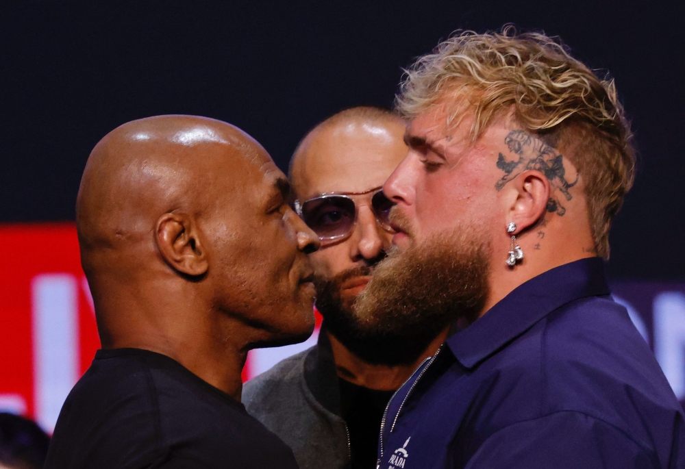 (Files) Former US boxer Mike Tyson (L) and YouTuber Jake Paul face off during a press conference at the Apollo Theatre in New York, on May 13, 2024. (Photo by Kena Betancur / AFP)
 