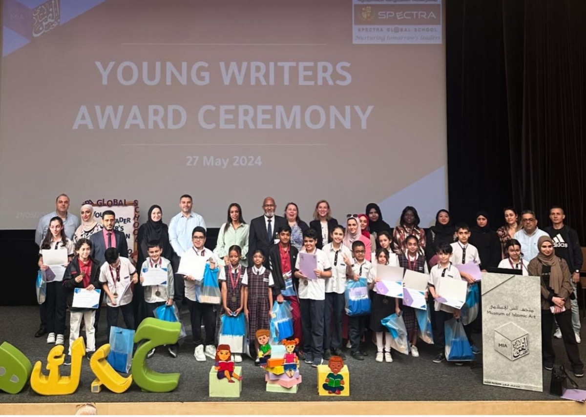 Participants and officials at the awards ceremony of the Young Writers event.