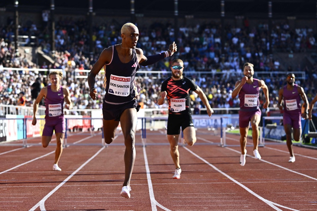 Brazil’s Alison dos Santos (left) win the men’s 400m hurdles event of the Stockholm Diamond League athletics meeting in Stockholm, Sweden, yesterday. Qatar's Abderrahman Samba (right) also competed in the race, marking his return from injury. AFP