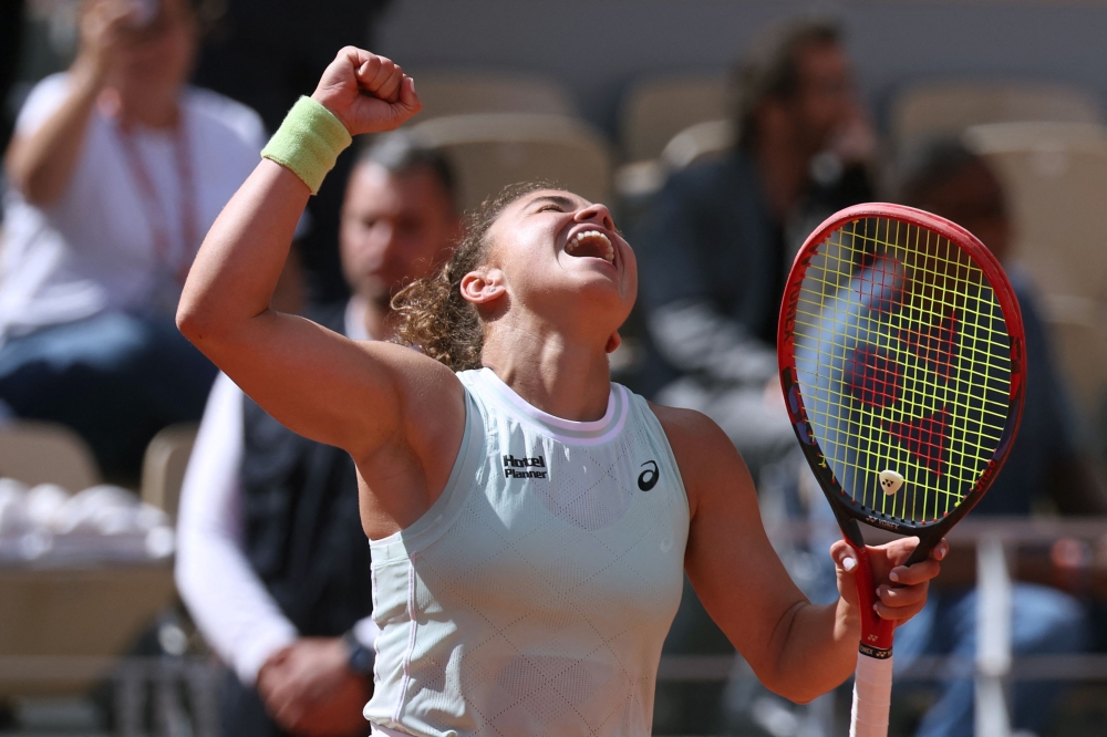 Italy's Jasmine Paolini celebrates after winning against Kazakhstan's Elena Rybakina at the end of their women's singles quarter final match on Court Philippe-Chatrier on day eleven of the French Open tennis tournament at the Roland Garros Complex in Paris on June 5, 2024. Photo by ALAIN JOCARD / AFP.