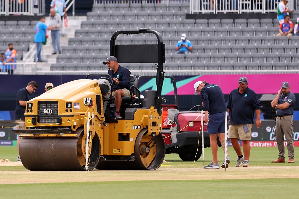 Members of the grounds staff prepare the pitch prior to the ICC Men's T20 Cricket World Cup West Indies & USA 2024 match between India and Pakistan at Nassau County International Cricket Stadium in New York. AFP