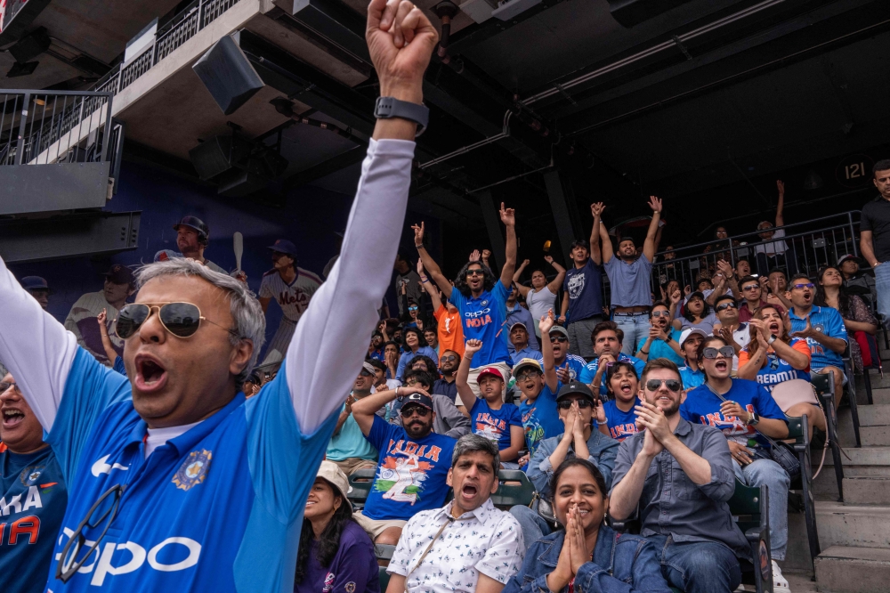 Fans react as they watch the India - Pakistan T20 Cricket World Cup match at a watch party at Citi Field on June 9, 2024 in New York City. Photo by Adam Gray / GETTY IMAGES NORTH AMERICA / Getty Images via AFP