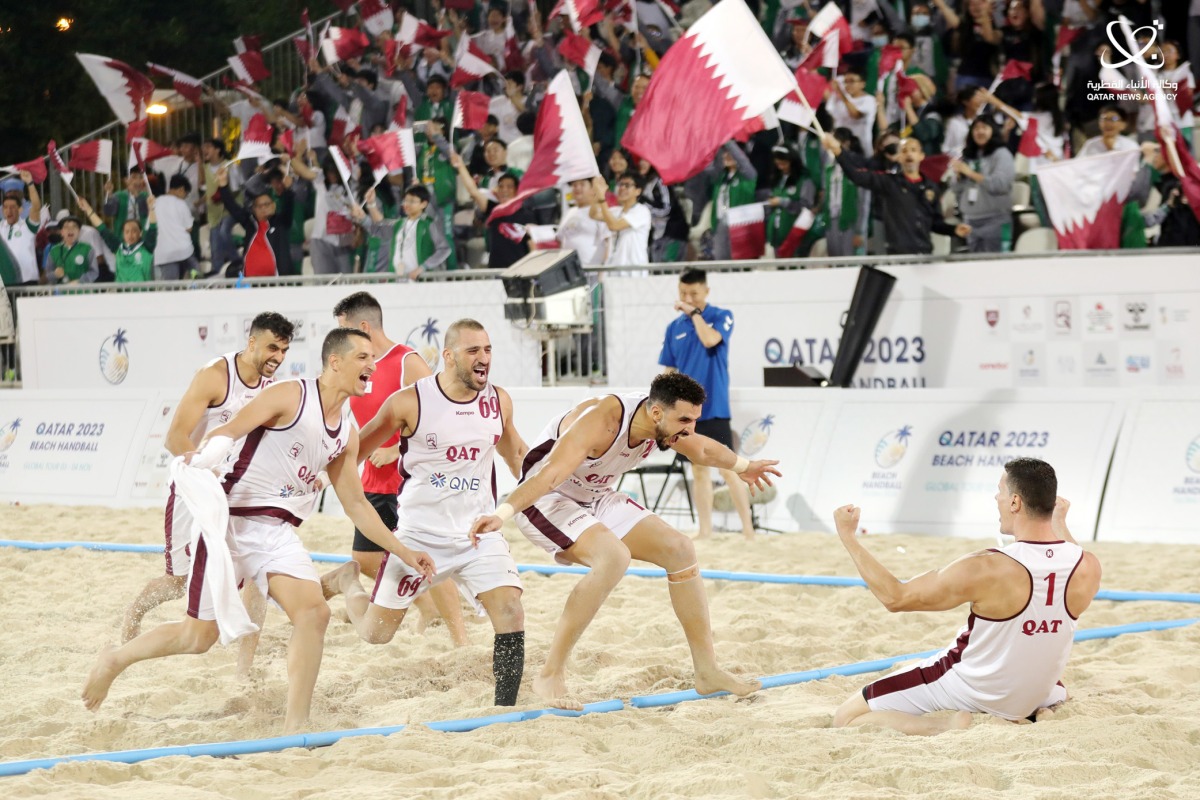 Qatar players celebrate after winning the 2023 IHF Beach Handball Global Tour final, in this file photo.