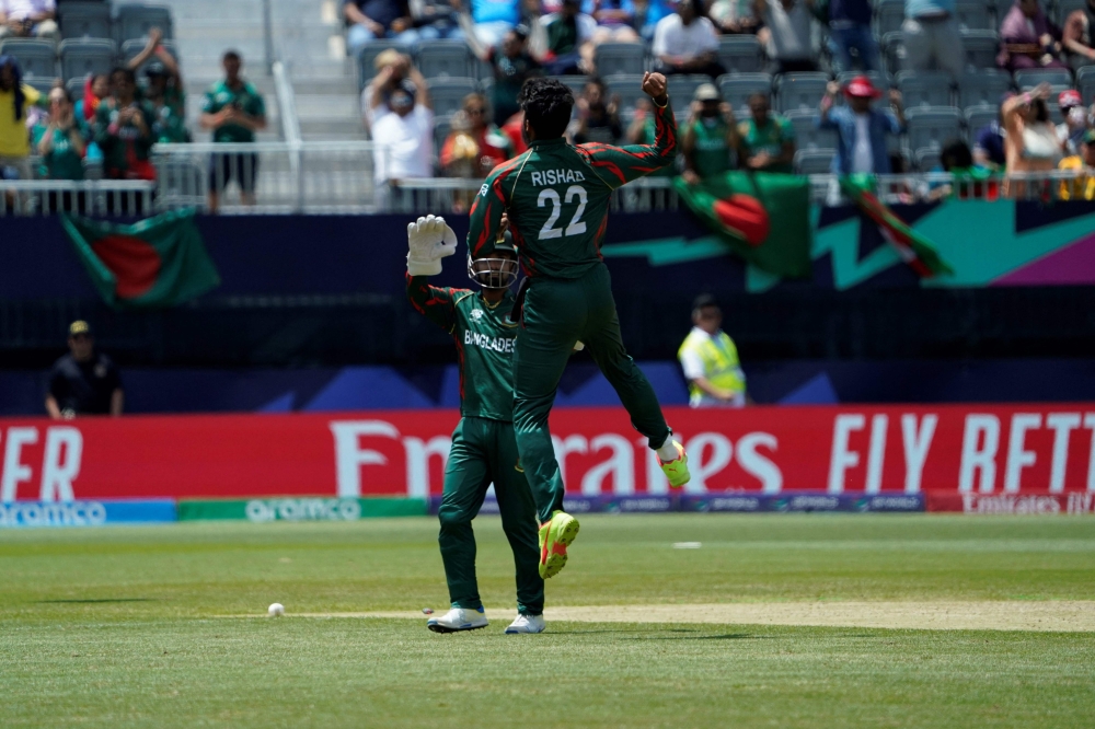 Bangladesh's Rishad Hossain celebrates bowling out South Africa's David Miller during the ICC men's Twenty20 World Cup 2024 group D cricket match between South Africa and Bangladesh at Nassau County International Cricket Stadium in East Meadow, New York on June 10, 2024. (Photo by Timothy A. Clary / AFP)