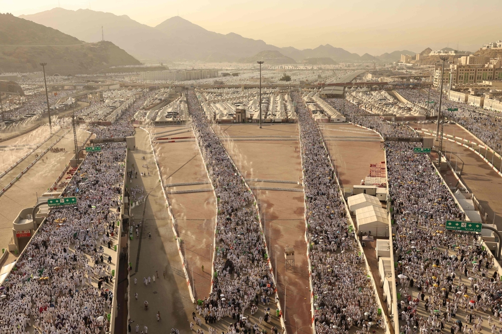 Pilgrims arrive to perform the symbolic 'stoning of the devil' ritual as part of the hajj pilgrimage in Mina, near Saudi Arabia's holy city of Mecca, on June 16, 2024. (Photo by Fadel Senna / AFP)