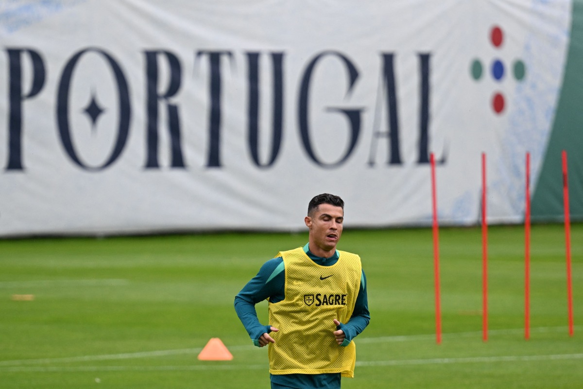 Portugal's forwardCristiano Ronaldo takes part in a training session at the team base in Harsewinkel, western Germany on June 16, 2024, during the UEFA Euro 2024 football Championship. (Photo by PATRICIA DE MELO MOREIRA / AFP)

