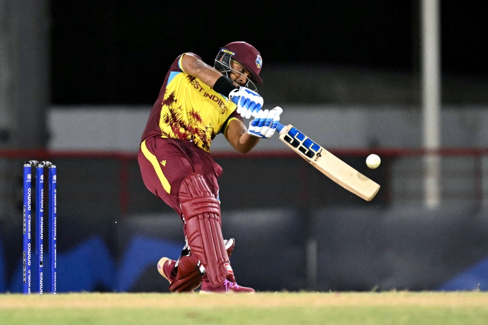 West Indies' Nicholas Pooran plays a shot during match between the West Indies and Afghanistan at Daren Sammy Cricket Ground in Gros Islet, St. Lucia, June 17, 2024. (Photo by Timothy A. Clary / AFP)