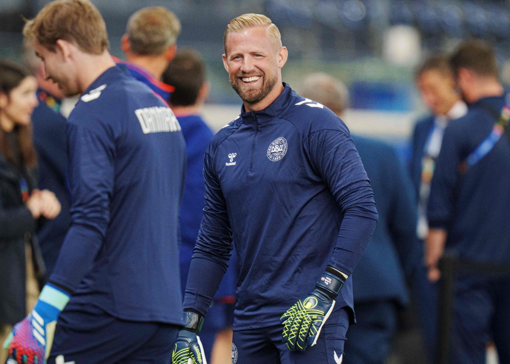 Denmark's goalkeeper #01 Kasper Schmeichel and Denmark's goalkeeper #22 Frederik Ronnow attend the training session of Denmark's national football team during the UEFA Euro 2024 in Frankfurt am Main, western Germany on June 19, 2024. (Photo by Liselotte Sabroe / Ritzau Scanpix / AFP) 