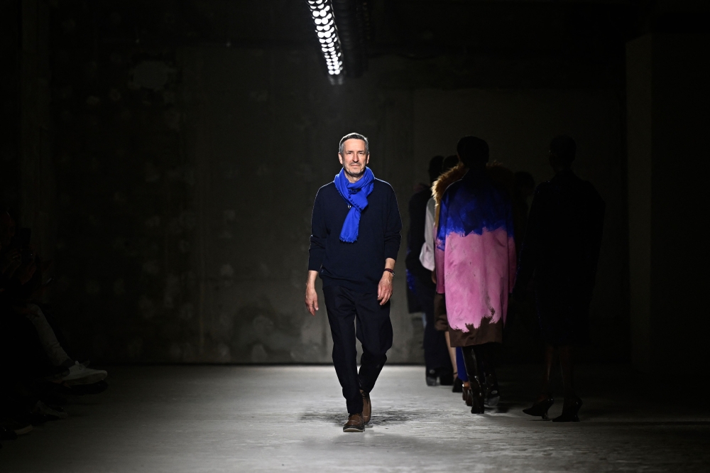 (Files) Belgium fashion designer Dries Van Noten acknowledges the audience after presenting creations by Dries Van Noten for the Women Ready-to-wear Fall-Winter 2024/2025 collection on February 28, 2024. (Photo by Julien De Rosa / AFP)