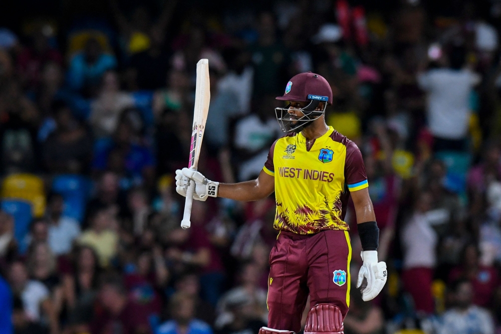 West Indies' Shai Hope celebrates after scoring a half-century (50 runs) during the ICC men's Twenty20 World Cup 2024 Super Eight cricket match on June 21, 2024. (Photo by Randy Brooks / AFP)