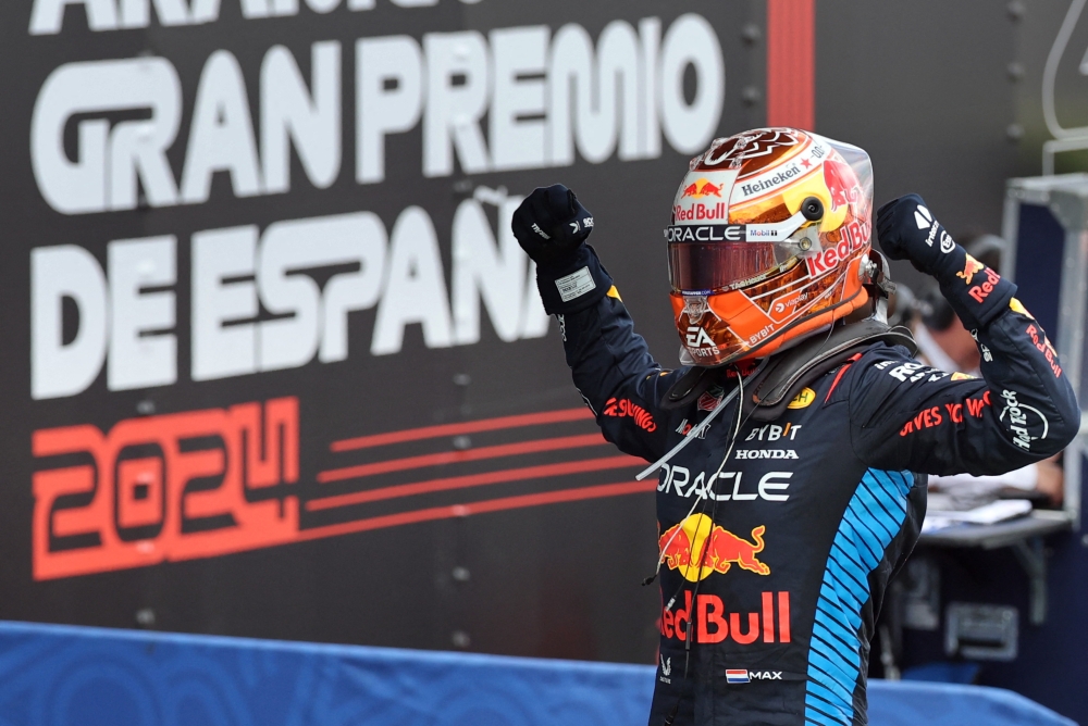 Red Bull's Dutch driver Max Verstappen celebrates winning the Spanish Formula One Grand Prix at the Circuit de Catalunya on June 23, 2024 in Montmelo, on the outskirts of Barcelona. (Photo by Thomas COEX / AFP)
