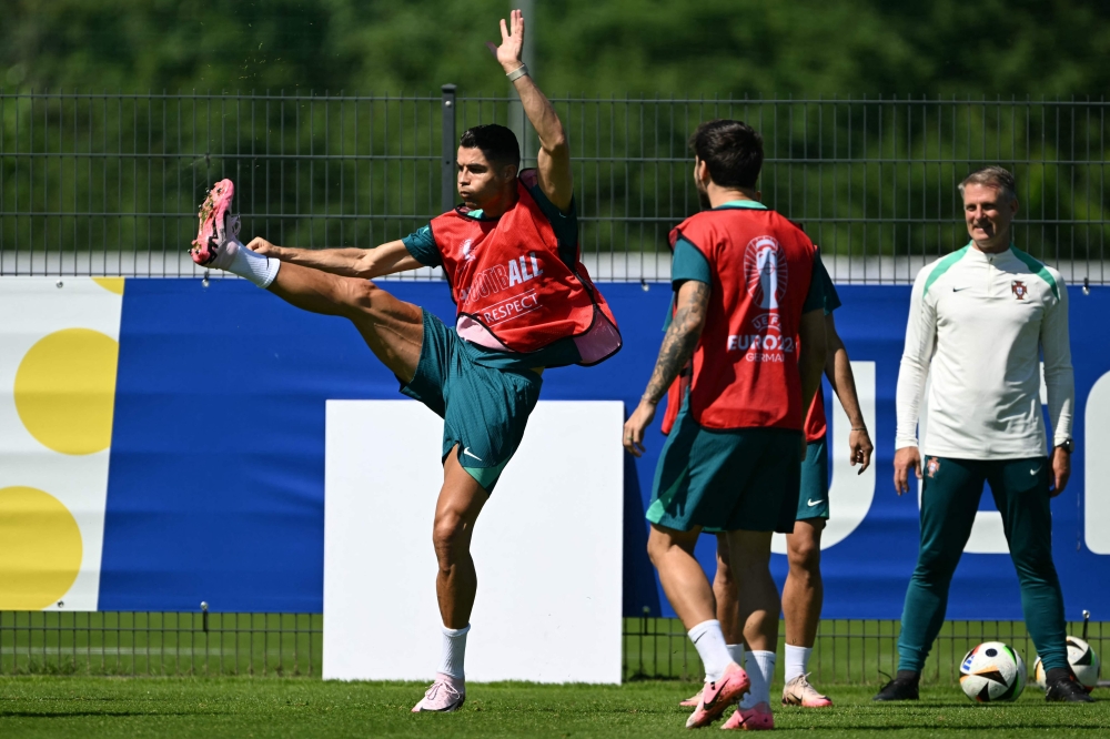 Portugal's forward #07 Cristiano Ronaldo takes part in an MD-1 training session in Marienfeld on June 25, 2024, on the eve of their UEFA Euro 2024 Group F football match against Georgia. (Photo by Patricia De Melo Moreira / AFP)