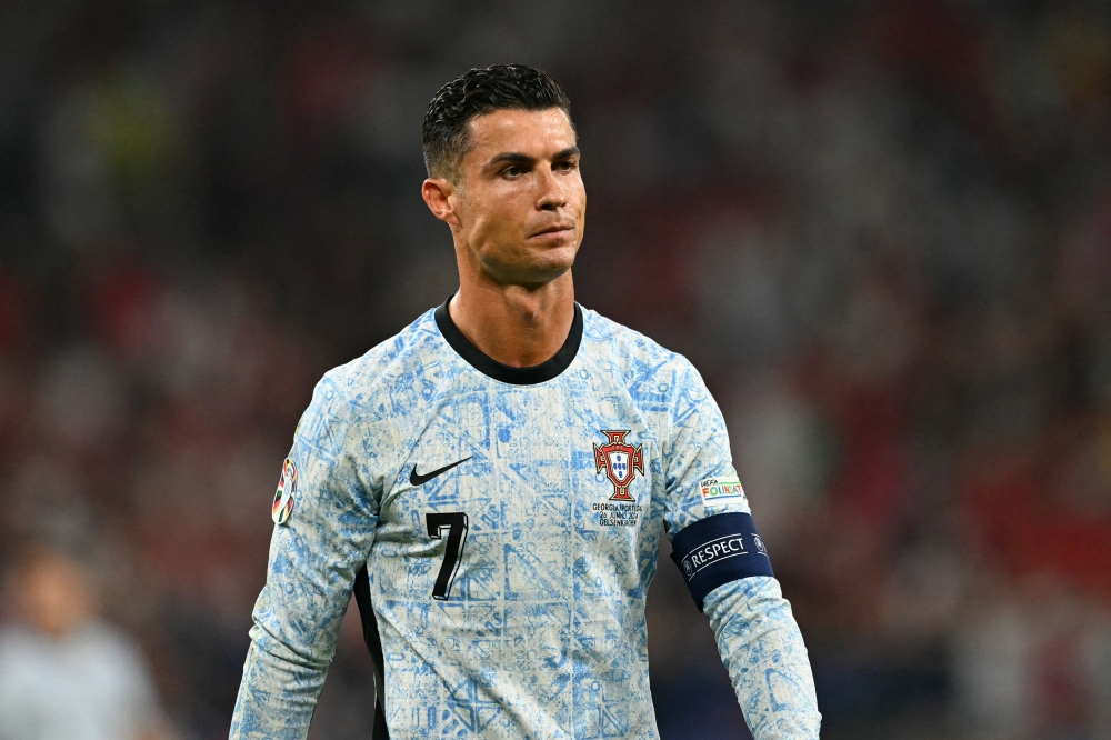 Portugal's forward #07 Cristiano Ronaldo reacts during the UEFA Euro 2024 Group F football match in Gelsenkirchen on June 26, 2024. (Photo by Ozan Kose / AFP)