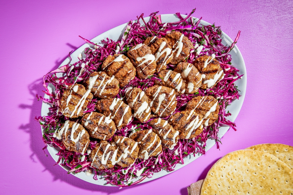 Grilled Merguez Patties With Cabbage Salad. Rey Lopez for The Washington Post; food styling by Lisa Cherkasky for The Washington Post