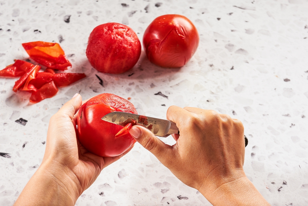 Peeling tomatoes is often not necessary - keep the skin and the flavor. (Photo by Rey Lopez for The Washington Post)