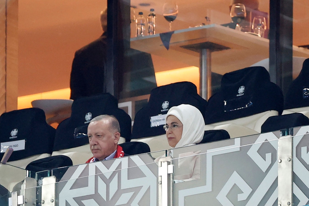 File: Turkish president Recep Tayyip Erdogan and his wife Emine attend the UEFA EURO 2020 Group A football match between Turkiye and Wales at the Olympic Stadium in Baku on June 16, 2021. (Photo by Valentyn Ogirenko / Pool / AFP)