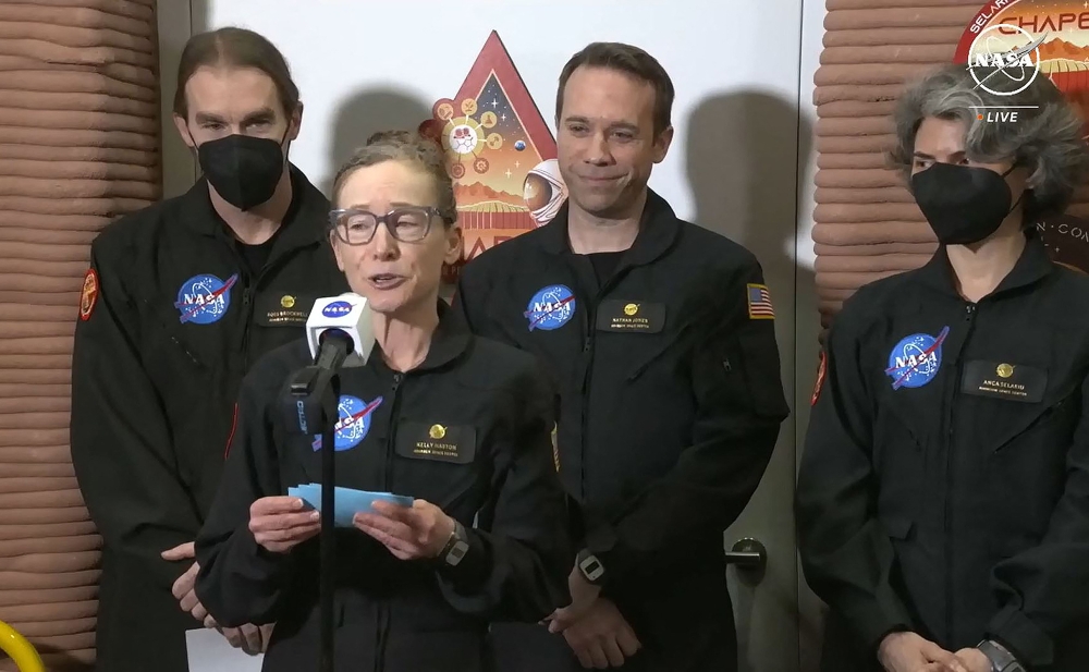 In this still image taken from a July 6, 2024, NASA TV broadcast, volunteer crew commander Kelly Haston speaks alongside crewmates (L-R) Ross Brockwell, Nathan Jones and Anca Selariu at Johnson Space Center in Houston, Texas. (Photo by Jose Romero / NASA TV / AFP) 