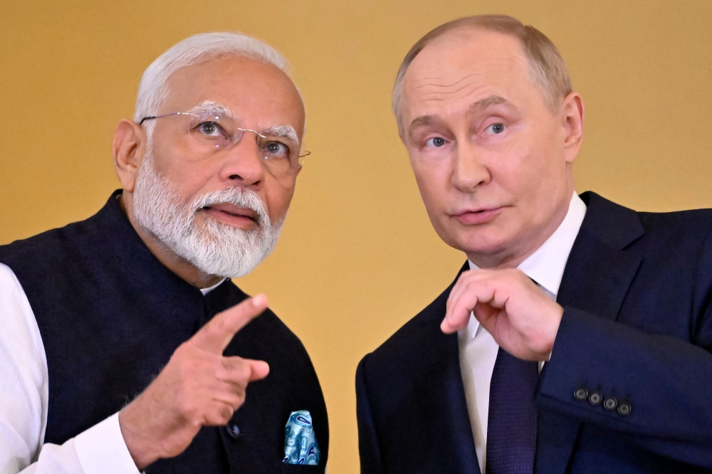 Russian President Vladimir Putin and Indian Prime Minister Narendra Modi attend a ceremony to decorate India's PM with the highest civilian honour at the Kremlin in Moscow on July 9, 2024. (Photo by Alexander Nemenov / AFP)