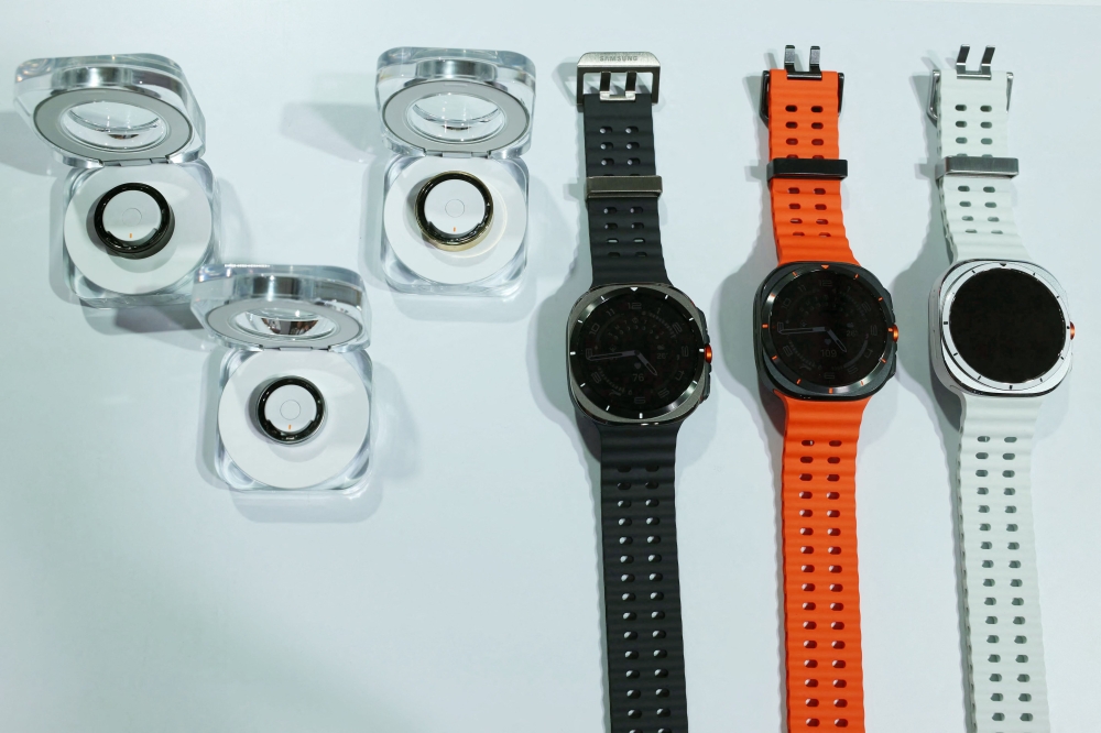 A display with the Samsung Galaxy Ring (L) and the Samsung Galaxi Watch Ultra is seen during the Samsung Galaxy Unpacked event in Paris on July 10, 2024. (Photo by Emmanuel Dunand / AFP)