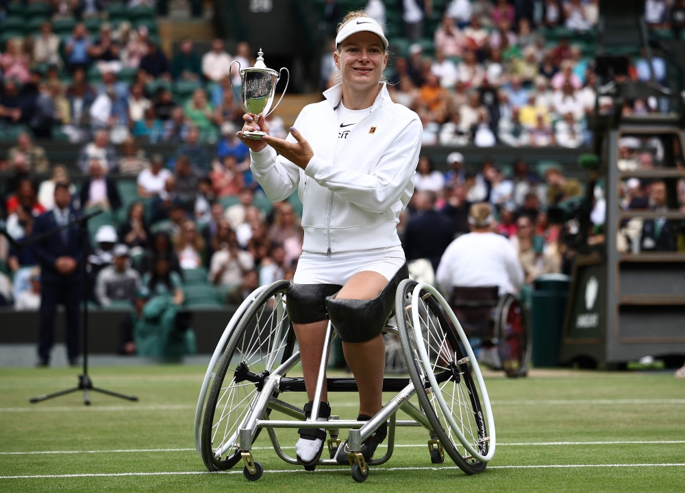 Netherlands' Diede De Groot poses with the winner's trophy in Wimbledon, southwest London, on July 13, 2024. (Photo by Henry Nicholls / AFP) 