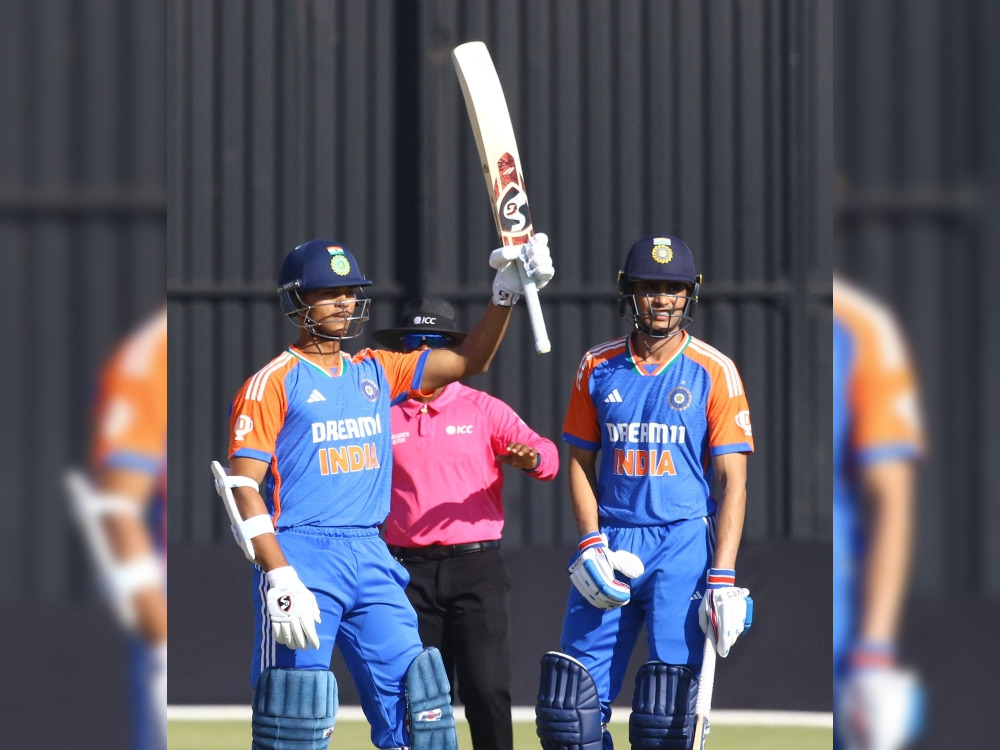 India's Yashasvi Jaiswal (L) celebrates after scoring a half century (50 runs) during the fourth T20 International cricket match between Zimbabwe and India at Harare Sports Club in Harare on July 13, 2024. (Photo by Jekesai NJIKIZANA / AFP)
