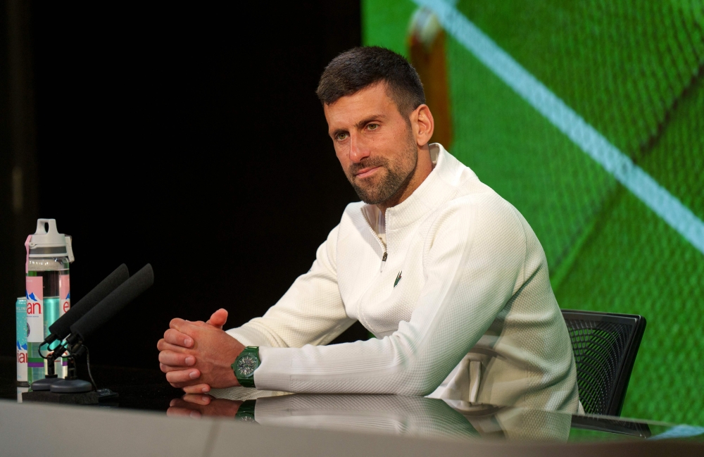 Serbia's Novak Djokovic attends a Press Conference in the Media Theatre in the Broadcast Centre, after losing to Spain's Carlos Alcaraz in their men's singles final tennis match on the fourteenth day of the 2024 Wimbledon Championships at The All England Lawn Tennis and Croquet Club in Wimbledon, southwest London, on July 14, 2024. (Photo by Joe TOTH / various sources / AFP)
