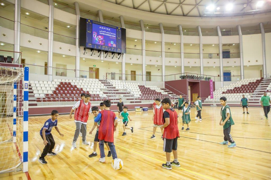 Children playing football at the camp. 