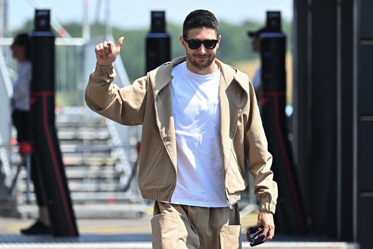 Alpine's French driver Esteban Ocon arrives at the Hungaroring race track in Mogyorod near Budapest on July 18, 2024, ahead of the Formula One Hungarian Grand Prix. (Photo by Attila KISBENEDEK / AFP)
