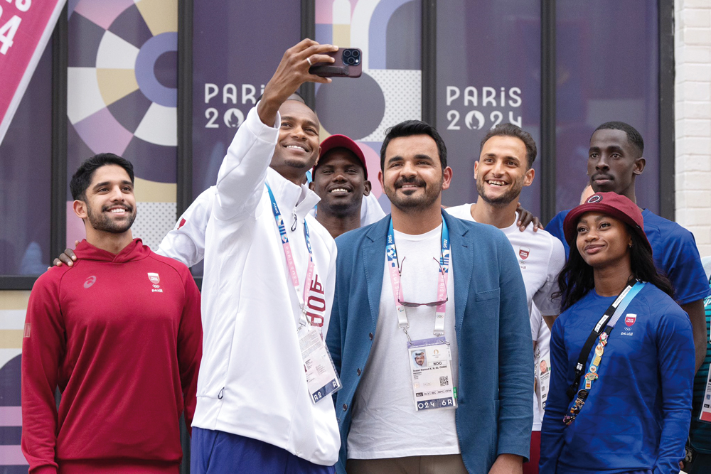 Qatar Olympic Committee President H E Sheikh Joaan bin Hamad Al Thani with Team Qatar athletes during his visit to the Olympic Village, in Paris, yesterday.