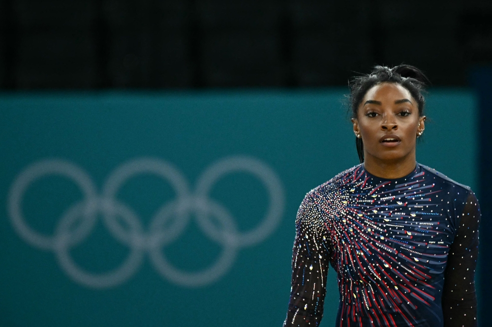 US' Simone Biles takes part in an artistic gymnastics training session at the Bercy Arena in Paris on July 25, 2024, ahead of the Paris 2024 Olympic Games. (Photo by Loic Venance / AFP)