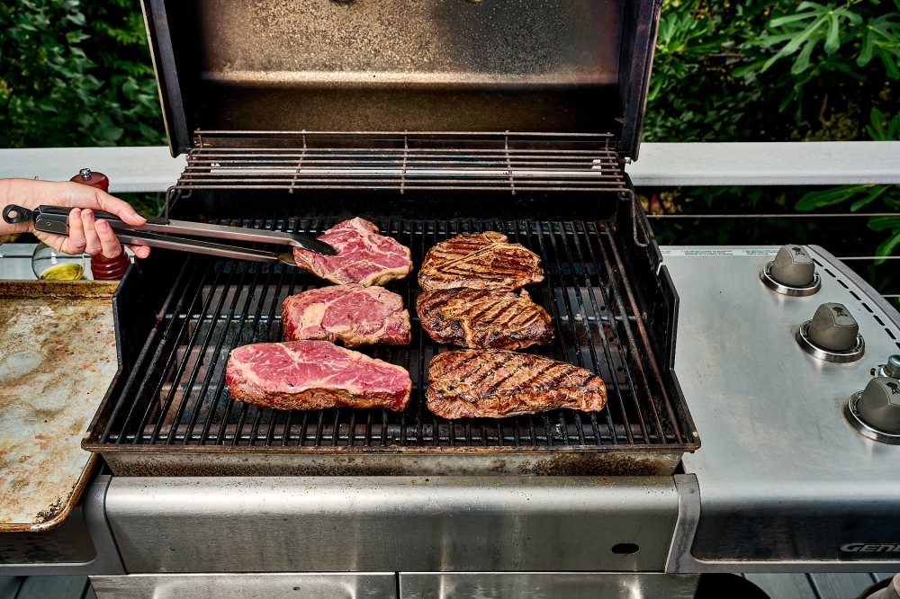 Cooking thicker cuts of steak over indirect heat will help achieve a tender interior without burning the exterior. (Photo by Peggy Cormary for The Washington Post)

