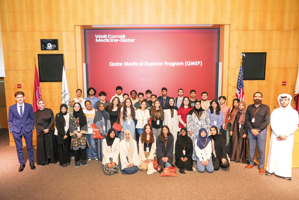 WCM-Q officials and student volunteers with high school students who took part in the Qatar Medical Explorer Programme.