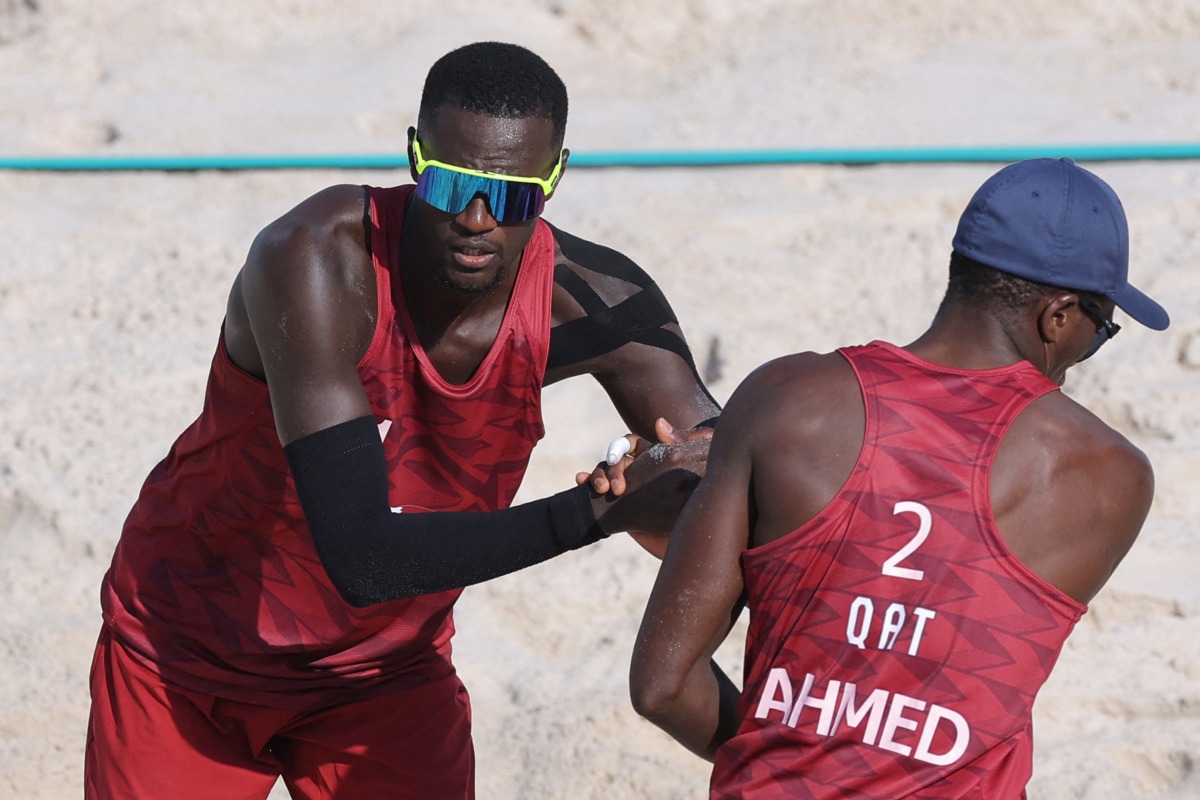 Qatar’s Cherif Younousse and Ahmed Tijan. 