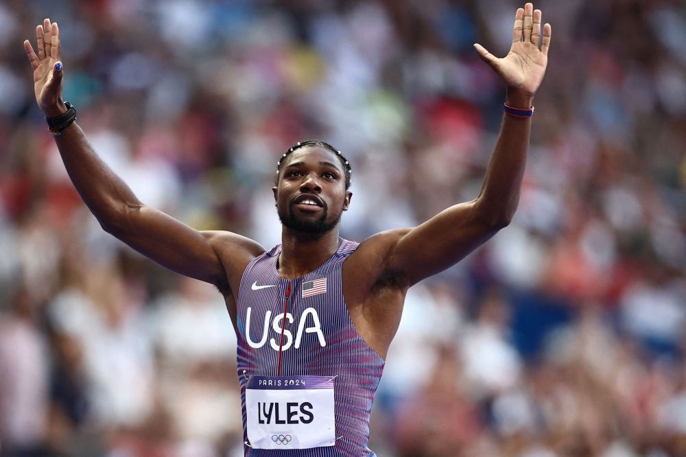 US' Noah Lyles reacts after competing in the men's 200m heat of the athletics event at the Paris 2024 Olympic Games at Stade de France in Saint-Denis, north of Paris, on August 5, 2024. (Photo by Anne-Christine Poujoulat / AFP)