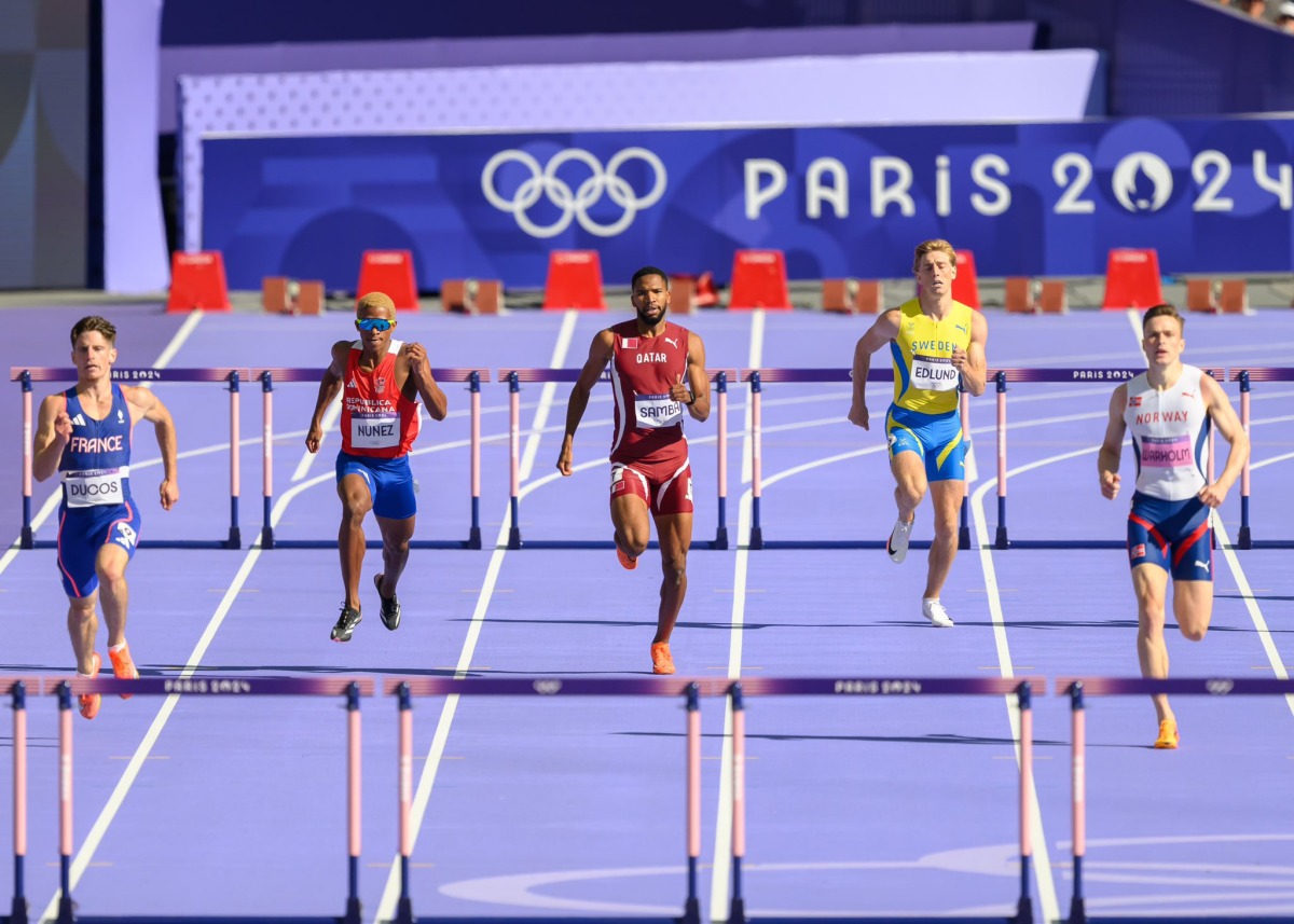 Qatar's Abderrahman Samba (centre) in action during the men's 400m hurdles heats, yesterday.