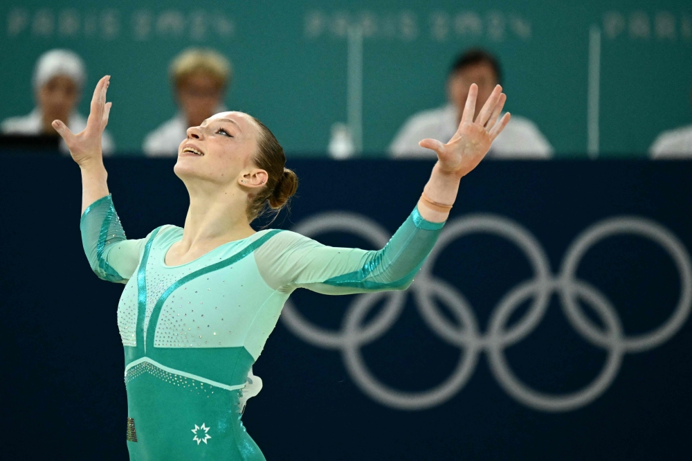 Romania's Ana Barbosu competes in the artistic gymnastics women's floor exercise final during the Paris 2024 Olympic Games at the Bercy Arena in Paris, on August 5, 2024. (Photo by Loic VENANCE / AFP)
