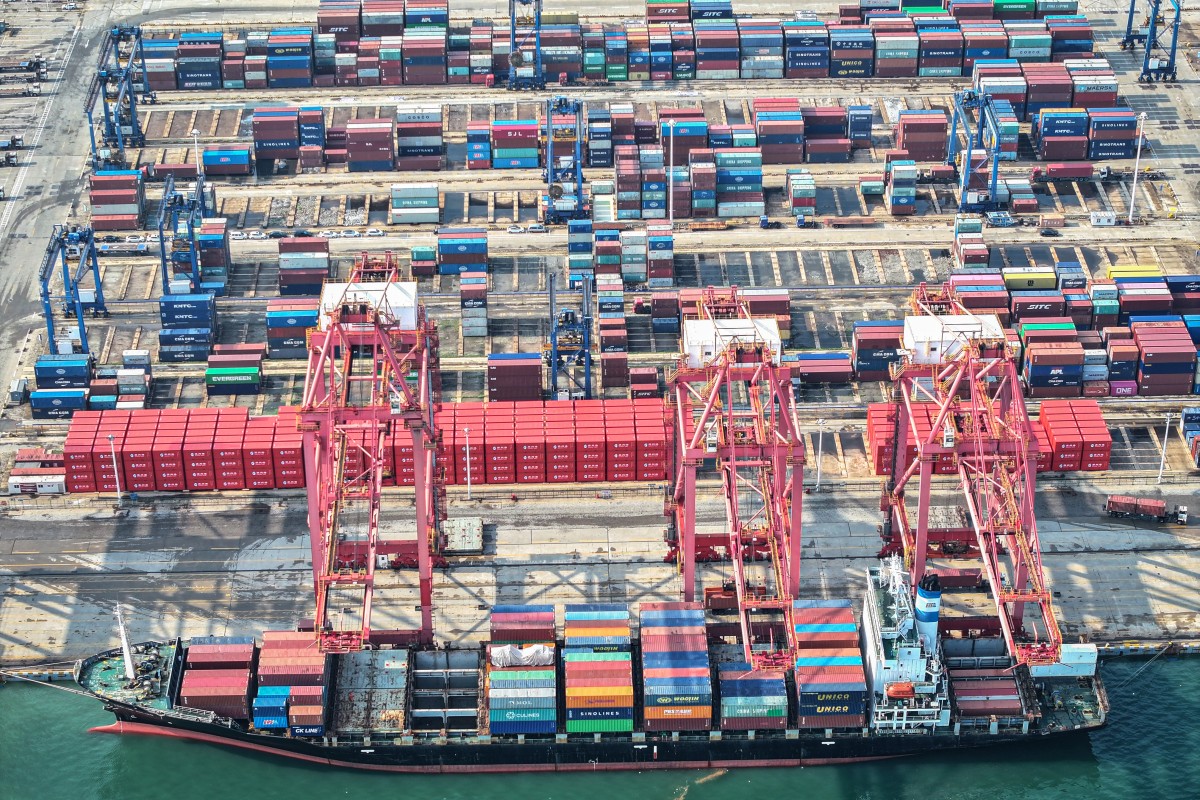 A cargo ship loaded with containers berths at a port in Lianyungang, in eastern China's Jiangsu province on August 7, 2024. Photo by AFP.