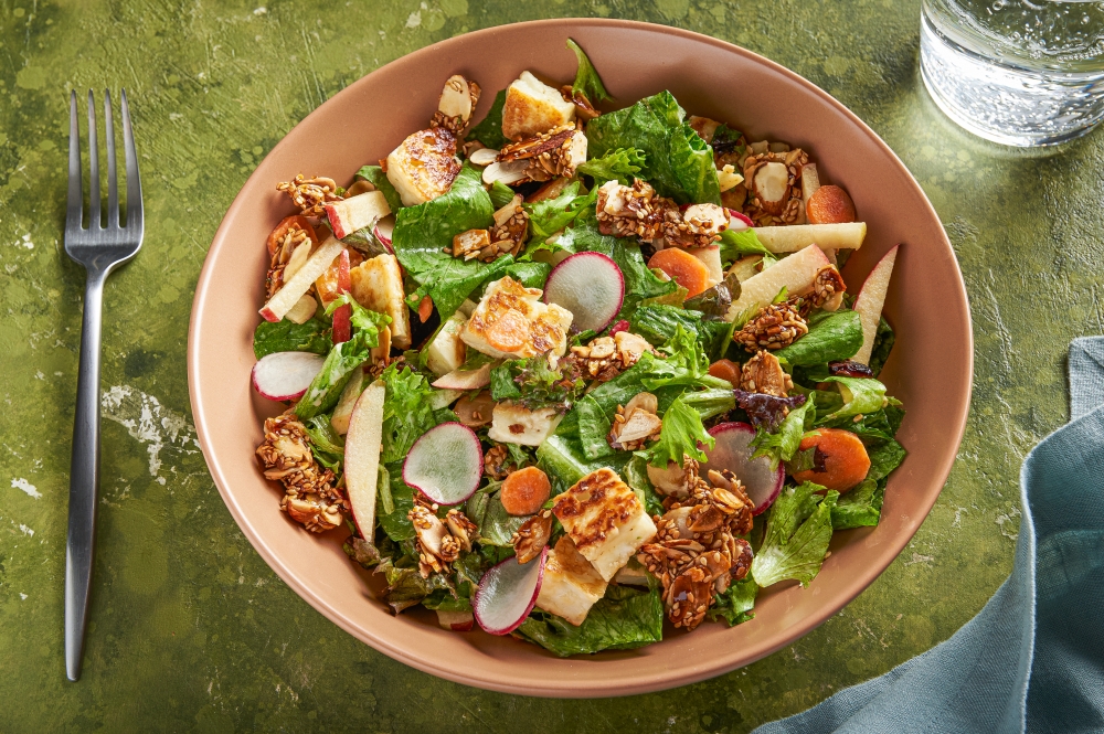 Halloumi salad with almond crunch and tahini dressing. (Photo by Rey Lopez for The Washington Post; food styling by Lisa Cherkasky for The Washington Post)

