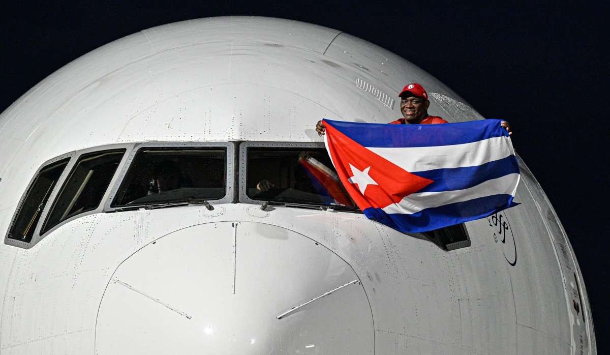 Paris 2024 Olympic Games men's greco-roman 130kg wrestling gold medallist Cuban Mijain Lopez, arrives at Havana's Jose Marti airport on August 12, 2024. (Photo by ADALBERTO ROQUE / AFP)
