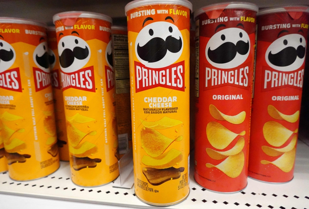 Packages of Pringles potato chips are displayed for sale in a store on August 14, 2024 in Los Angeles, California. (Photo by Mario Tama/Getty Images/AFP)
