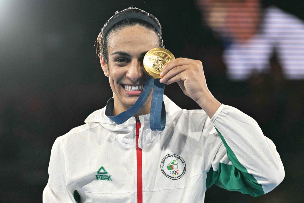 Algeria's Imane Khelif poses with her gold medal.