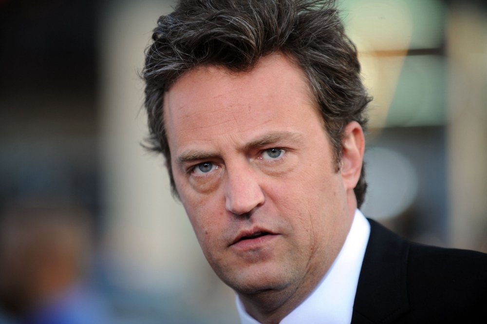 File: Actor Matthew Perry arrives at the Los Angeles premiere of 17 Again at the Grauman's Chinese Theater in Hollywood, California, April 14, 2009. (Photo by Gabriel Bouys / AFP)