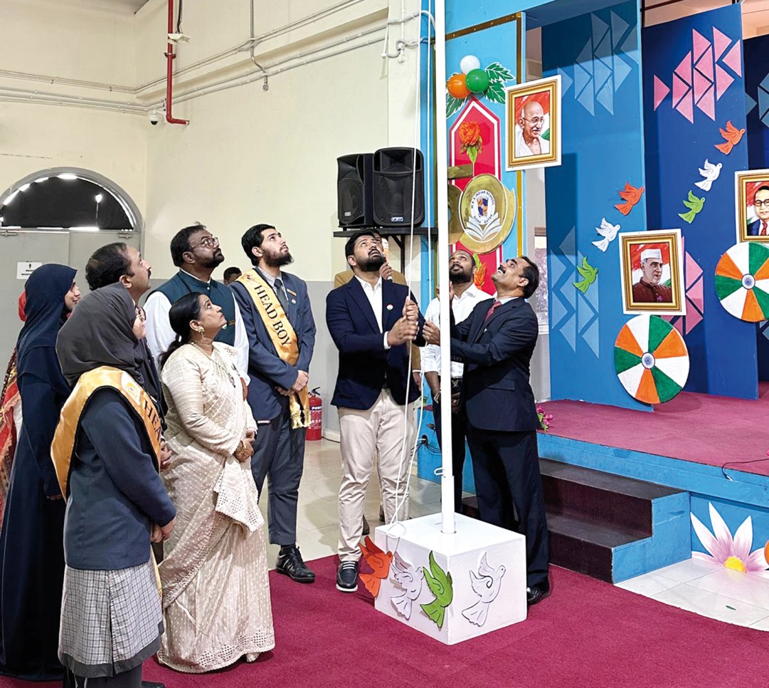 Guests and officials unfurl the Indian national flag on the occasion.