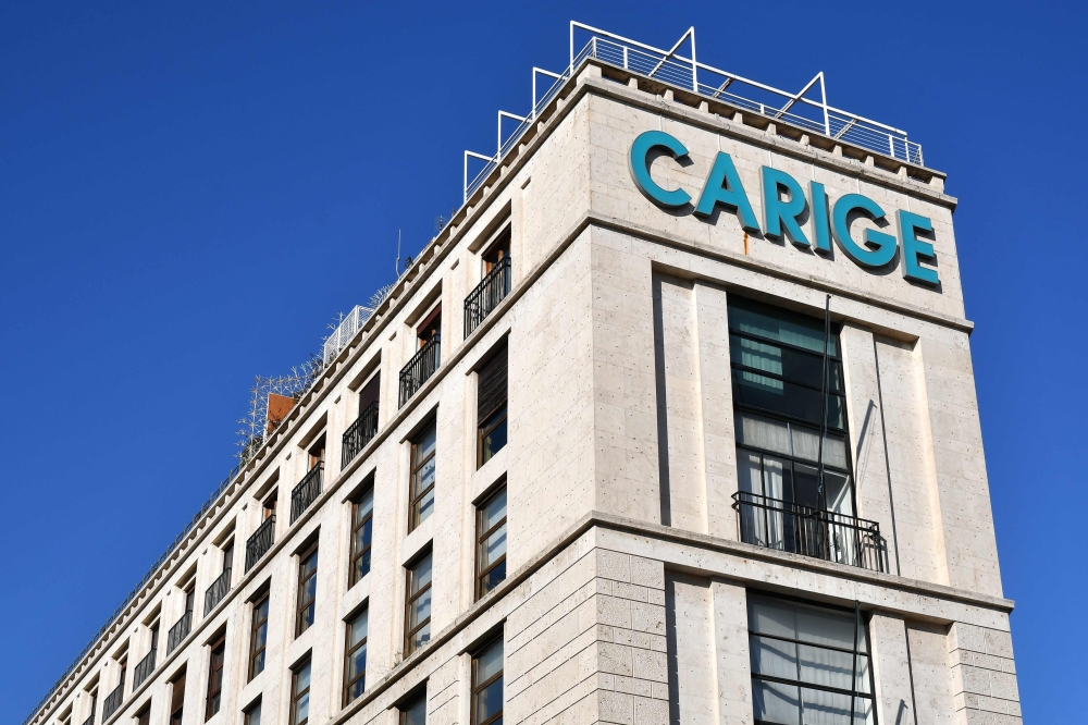 The logo of Italian bank Carige Italia is pictured at a bank's branch in downtown Rome on January 2, 2019. AFP / Alberto PIZZOLI

