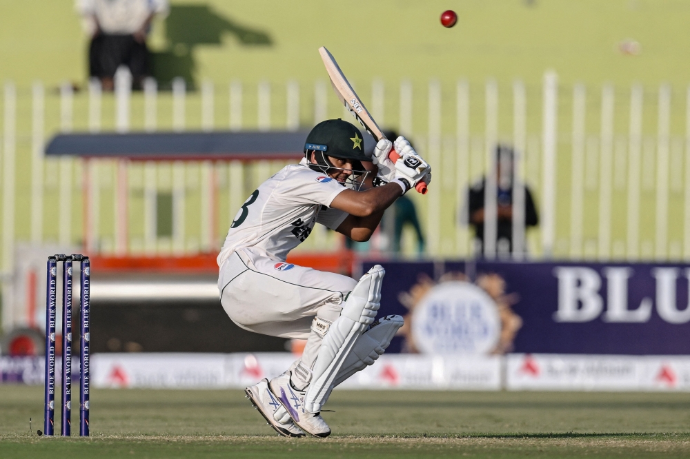 Pakistan's Saim Ayub avoids a bouncer ball during the first day of the first Test cricket match between Pakistan and Bangladesh at the Rawalpindi Cricket Stadium in Rawalpindi on August 21, 2024. (Photo by Farooq NAEEM / AFP)
